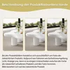 Three identical white coffee tables are displayed side-by-side in a well-lit room with large windows and greenery visible outside. The tables have a unique, organic, cloud-like shape and are decorated with small candles and a vase of flowers. Produktbild-Vorschau