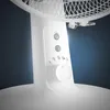 Close-up shot of the control panel and base of a white electric fan. Náhľad obrázku produktu