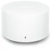 A white, cylindrical portable speaker with a perforated top. Podgląd zdjęcia produktu