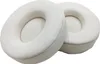 Two white ear pads for headphones are shown against a white background. Náhled obrázku produktu