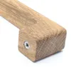Close-up of a wooden object with a metal insert. Produktbild-Vorschau