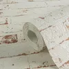 A roll of wallpaper with a brick pattern. Produktbild-Vorschau