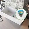 A bathtub with a drain stopper featuring a turtle. Produktbild-Vorschau