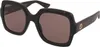 A pair of tortoiseshell sunglasses with brown lenses, shown from a side-angle. Podgląd zdjęcia produktu