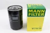 A product shot of a MANN-FILTER W 719/30 oil filter and its packaging, set against a white background. Podgląd zdjęcia produktu