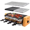 A raclette grill with multiple cooking surfaces and accessories, presented in a studio setting. Produktbild-Vorschau