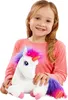 A young girl is holding a plush unicorn toy. Produktbild-Vorschau