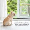 A French Bulldog sits on a white floor looking towards a screen door with a cat flap installed. Náhled obrázku produktu