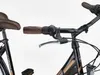 A close-up view of a bicycle's handlebars and seat. Produktbild-Vorschau