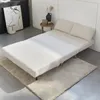 A cream-colored sofa bed is shown in a minimalist room setting. Produktbild-Vorschau