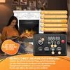 A woman is sitting in front of an electric fireplace, reading a book. The fireplace has a realistic flame effect. A remote control for the fireplace is in the foreground. Produktbild-Vorschau