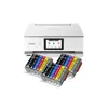 A white Canon printer with a stack of ink cartridges in front of it. Produktbild-Vorschau