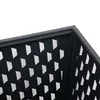 A close-up view of the corner of a black metal basket with a perforated pattern. Náhled obrázku produktu