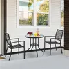 A black metal bistro set with two chairs and a table on a porch. Produktbild-Vorschau