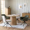 A dining room setting with a round wooden table and chairs. Produktbild-Vorschau