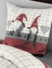 A close-up view of a pillow with a festive gnome design. Produktbild-Vorschau