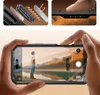 A collage showing a phone case, a close-up of a phone's side buttons, and a person holding a phone to take a picture of a landscape. Produktbild-Vorschau