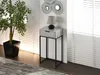 A narrow console table with a drawer and a lamp on top, placed next to a potted plant and a wall with decorative circles. Anteprima dell’immagine prodotto