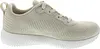 A side view of a beige Skechers sneaker. Voir les images du produit