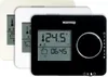 Three Warmup Tempo digital thermostats are shown, with the black one in the foreground displaying the current temperature and time. Anteprima dell’immagine prodotto