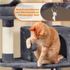 An orange cat is playing with a toy mouse hanging from a cat tree. Podgląd zdjęcia produktu