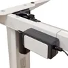 A close-up view of the motorized lifting mechanism and control box of an adjustable standing desk. Podgląd zdjęcia produktu