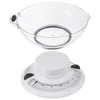 A transparent mixing bowl is placed on top of a white mechanical kitchen scale. Voir les images du produit
