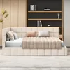 A modern bedroom setting with a beige upholstered bed and a built-in bookshelf. Náhľad obrázku produktu