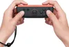 Hands holding a Nintendo Joy-Con controller. Produktbild-Vorschau