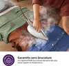 A person is ironing clothes with a steam iron. The clothes are of different colors and materials, including denim and a light green fabric. Text overlays provide product information. Voir les images du produit