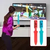 A young girl plays a video game on a TV, holding a blue sword accessory. The game shows two characters dueling with swords. A close-up inset shows red and blue controller attachments. Produktbild-Vorschau