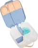 An open blue and peach snack box with multiple compartments. A small blue ice pack with a snowflake design is inside one of the compartments. Anteprima dell’immagine prodotto