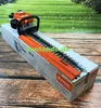 A Stihl hedge trimmer is shown in its packaging, with a grassy background. Produktbild-Vorschau