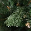 A close-up view of artificial pine needles on a Christmas tree. Produktbild-Vorschau