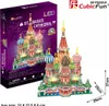 A 3D puzzle of St. Basil's Cathedral is shown on its packaging, with the assembled puzzle model displayed next to it. Anteprima dell’immagine prodotto