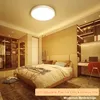A modern bedroom with a bed, closet, and desk, illuminated by a ceiling light. Produktbild-Vorschau