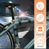 A bicycle frame bag with reflective elements attached to a bicycle frame on a wet street at night. Produktbild-Vorschau