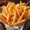A close-up shot of a basket filled with french fries. Anteprima dell’immagine prodotto