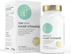 A product shot of a bottle of Cosphera Haar Vitamine supplements next to its packaging. Produktbild-Vorschau
