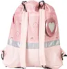 A pink backpack with a rainbow pattern and a heart-shaped charm. Voir les images du produit