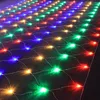 A net of colorful LED lights spread out on a dark wooden floor. Náhled obrázku produktu