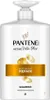 A white bottle of Pantene shampoo with gold accents. Podgląd zdjęcia produktu