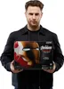 A man holds a product box for an Iron Man helmet. Podgląd zdjęcia produktu