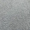 A close-up, textured view of a grey fabric, likely a sofa or armchair. Produktbild-Vorschau