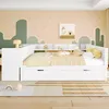 A child's bedroom with a white bed and decorative wall art. Voir les images du produit