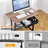 A collage of images showing a height-adjustable desk with a computer setup, a drawer, and comparison shots of the desk's stability mechanism. Anteprima dell’immagine prodotto