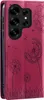 A close-up view of a magenta phone case with a dandelion design. Produktbild-Vorschau