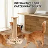 Three orange cats interact with a wooden cat scratching post and toy. Produktbild-Vorschau