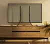 A TV stand with a TV mounted on it, placed on a wooden cabinet. Náhled obrázku produktu