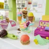 A Play-Doh ice cream set with various colorful ice cream creations and accessories. Produktbild-Vorschau